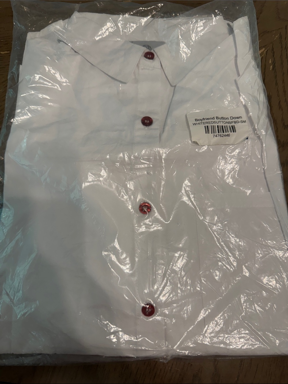 Women’s White Button-Down Shirt with Red Buttons